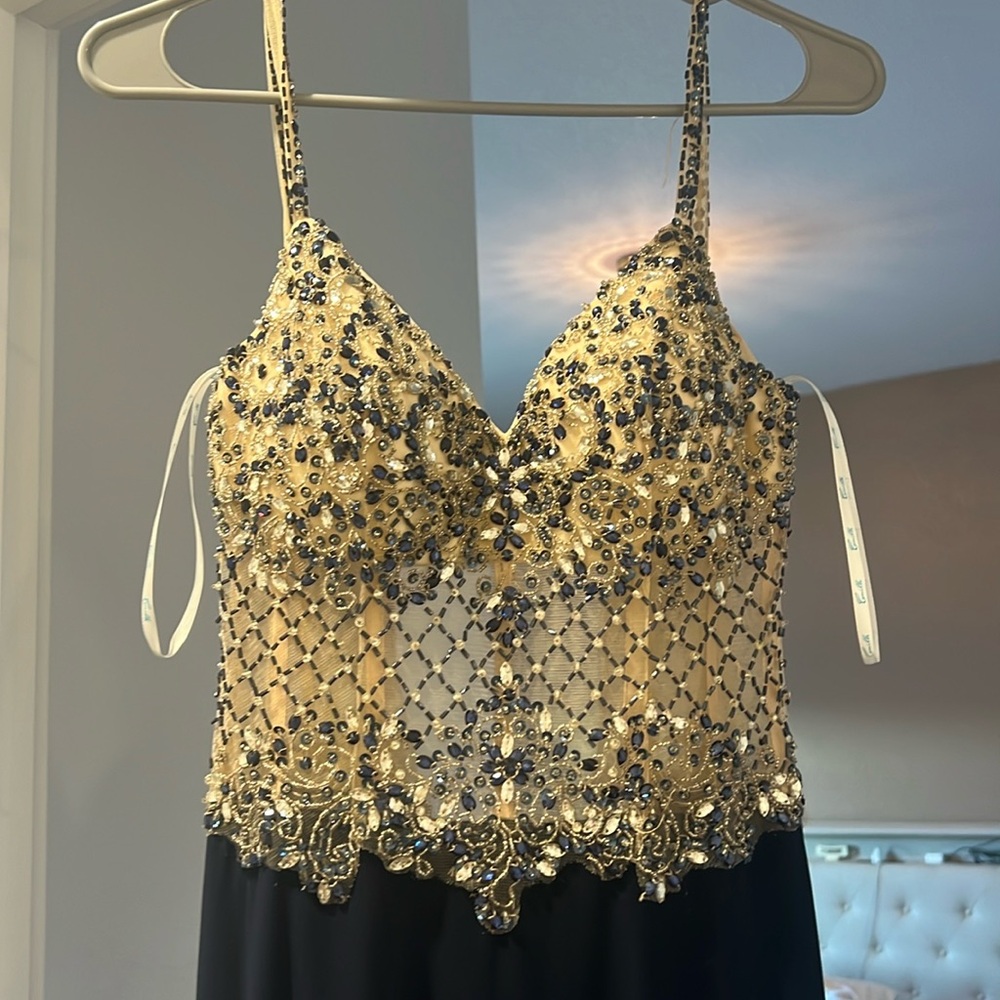 Gem bra and waist stitched dress, flowing body with leg slit.